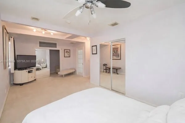 a bedroom with a bed and a chair