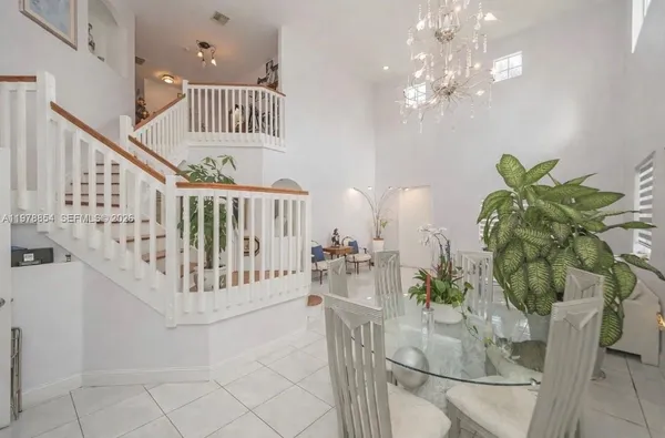 a view of staircase with furniture and wooden floor