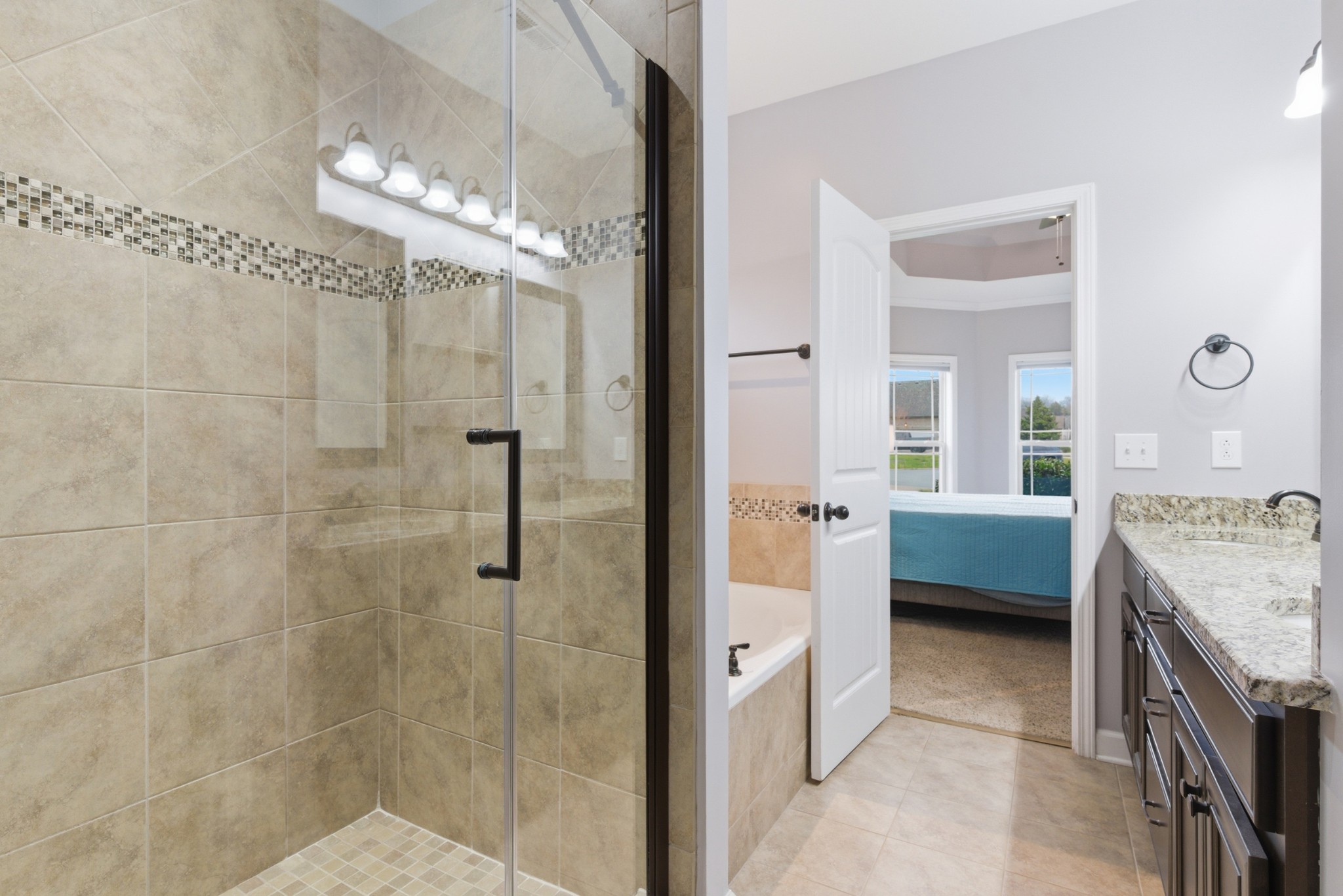 108 Amazonway Ridge Lascassas, TN 37085 - Photo 14 of 31 a bathroom with a tub sink shower and a mirror