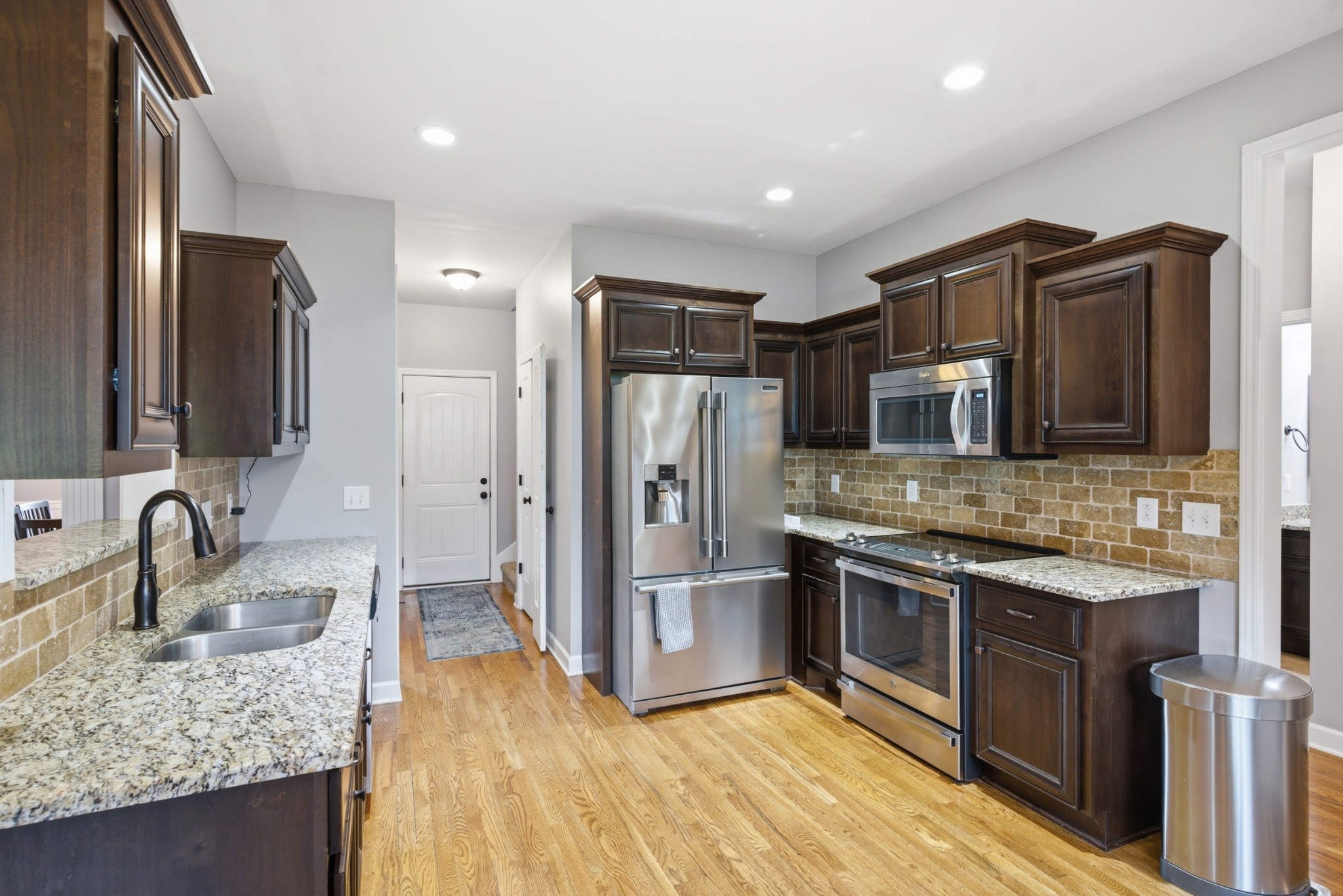 108 Amazonway Ridge Lascassas, TN 37085 - Photo 10 of 31 a kitchen with stainless steel appliances granite countertop a sink stove and refrigerator
