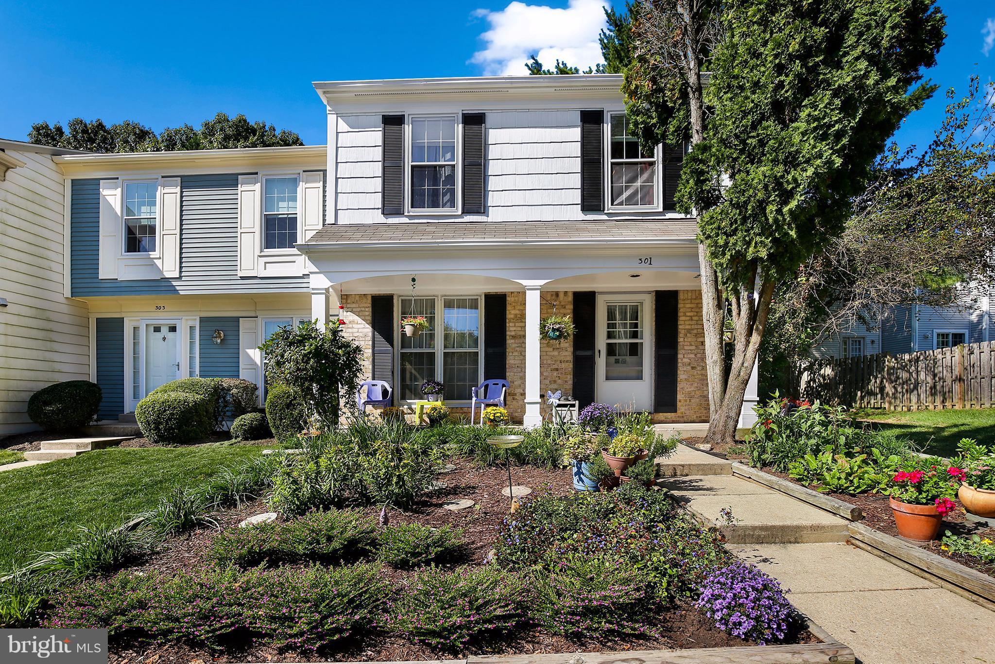 301 Crescendo Way Silver Spring, MD 20901 - Photo 1 of 30 a front view of a house with a yard