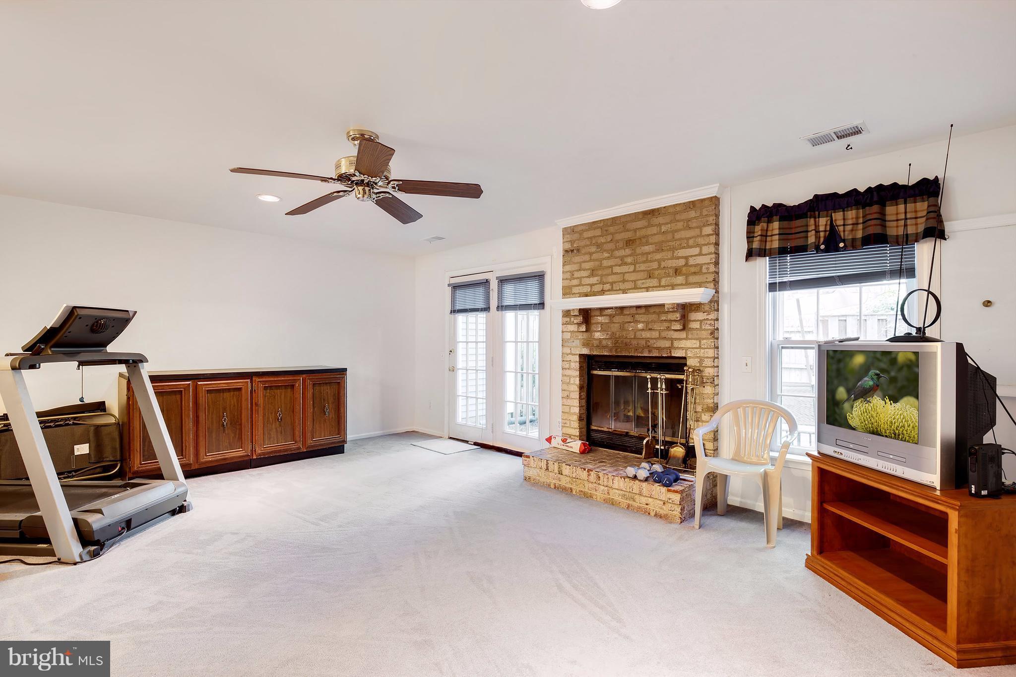 301 Crescendo Way Silver Spring, MD 20901 - Photo 2 of 30 a living room with furniture and a fireplace