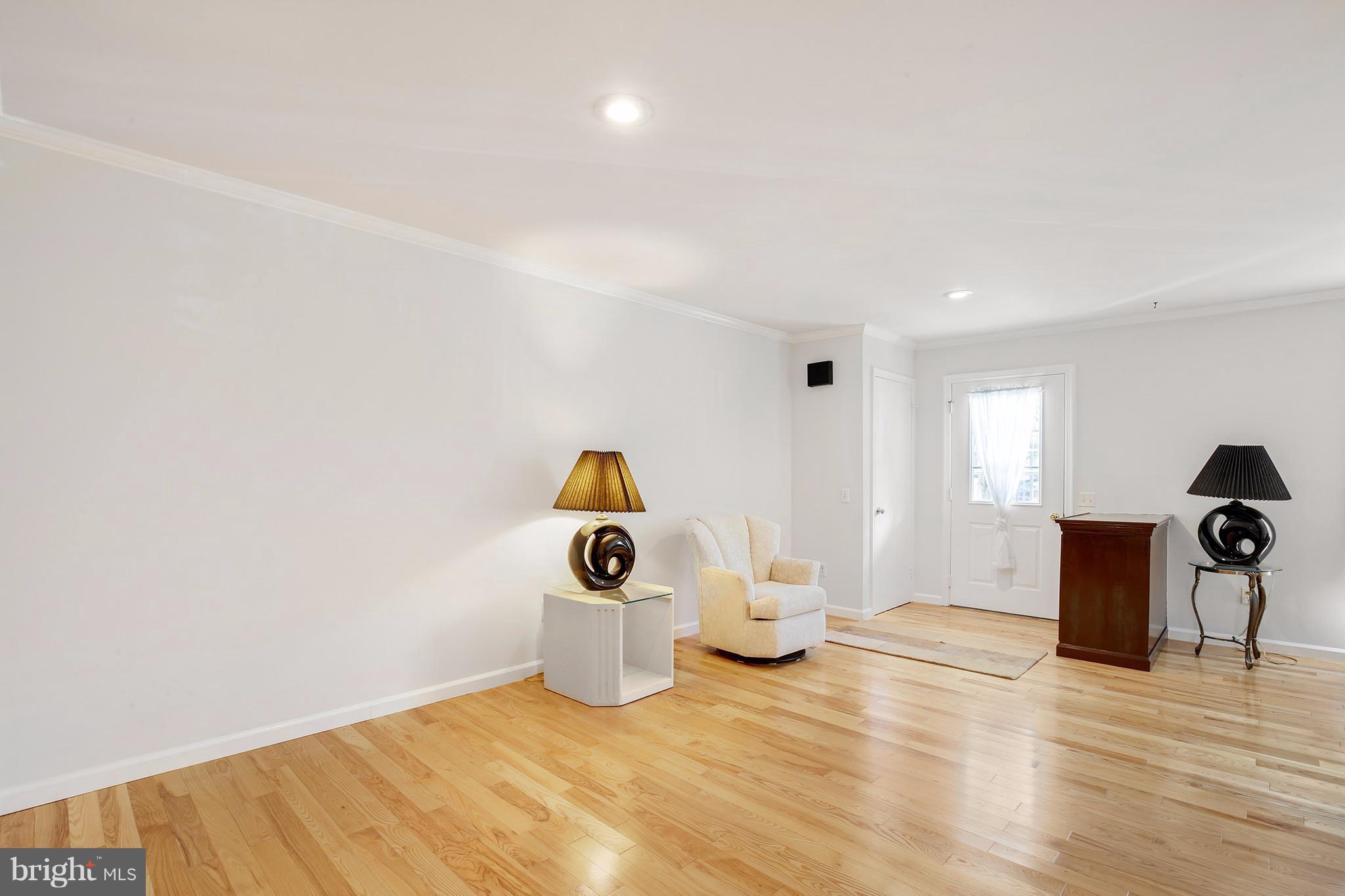301 Crescendo Way Silver Spring, MD 20901 - Photo 11 of 30 a view of a livingroom with wooden floor and a sink