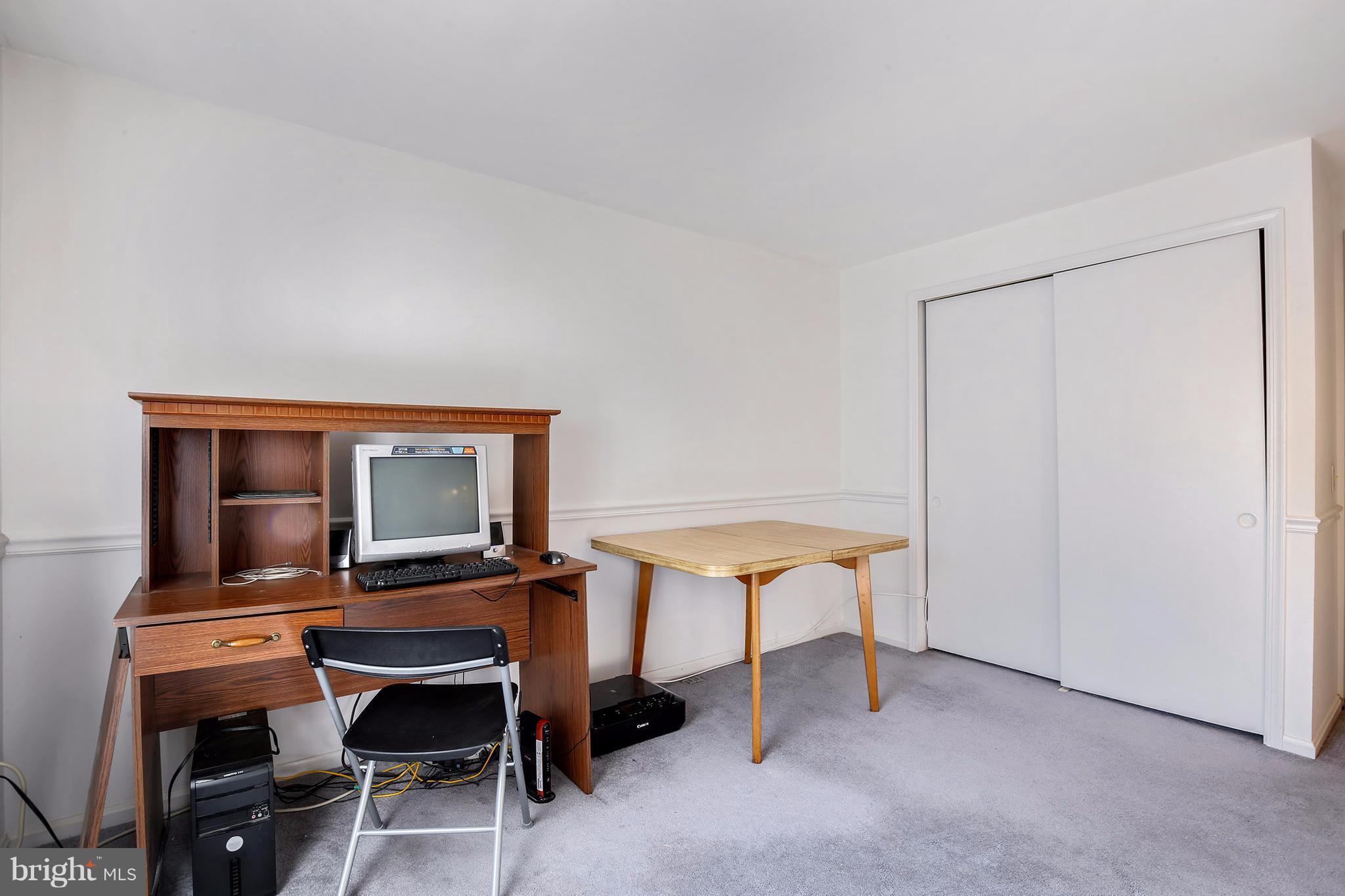 301 Crescendo Way Silver Spring, MD 20901 - Photo 20 of 30 a room with furniture and a table