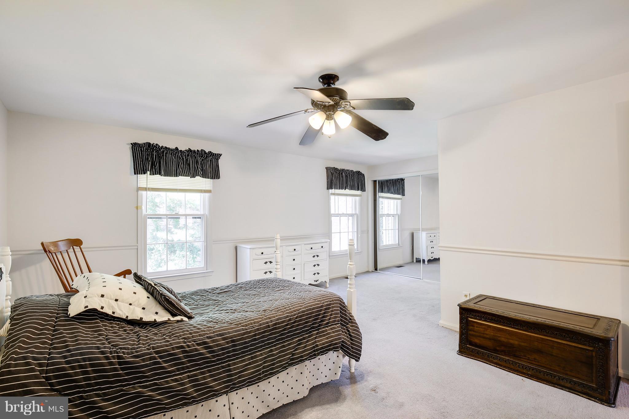 301 Crescendo Way Silver Spring, MD 20901 - Photo 25 of 30 a bedroom with a bed couch and window