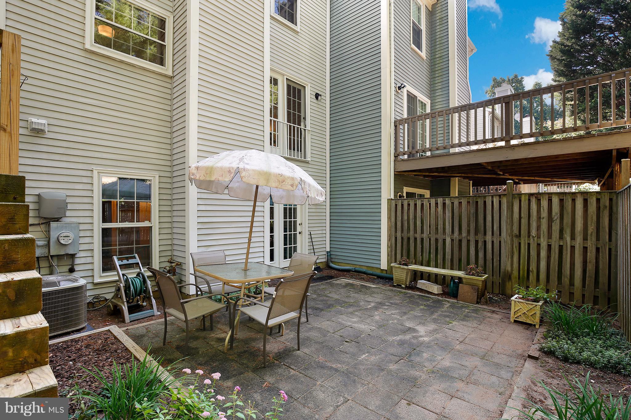 301 Crescendo Way Silver Spring, MD 20901 - Photo 29 of 30 a view of a house with backyard and sitting area