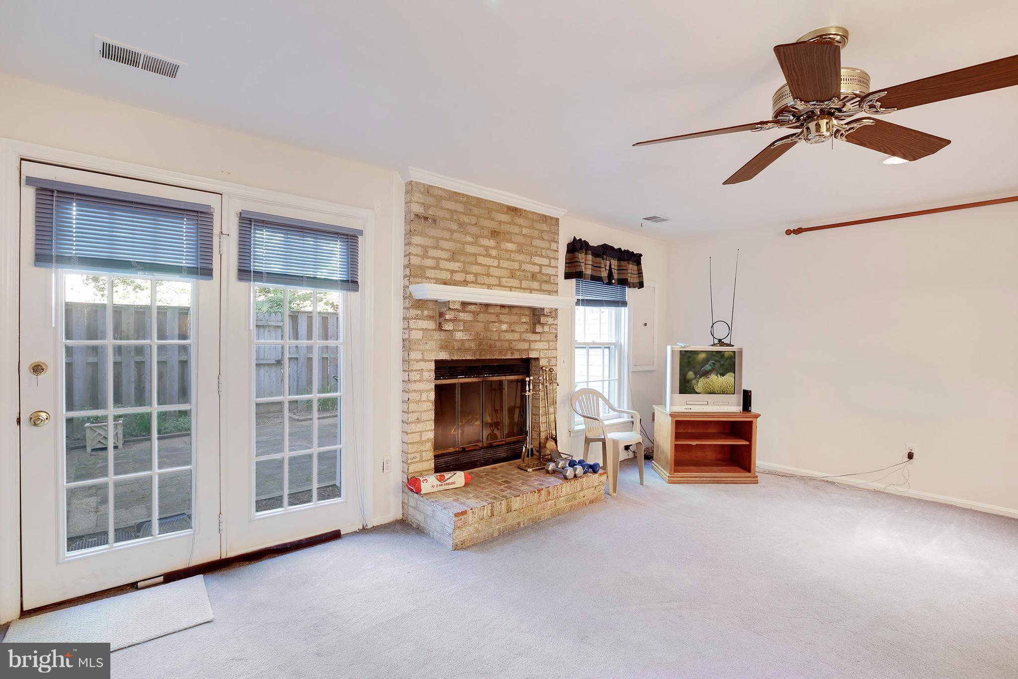 301 Crescendo Way Silver Spring, MD 20901 - Photo 4 of 30 a view of livingroom with furniture and a fireplace