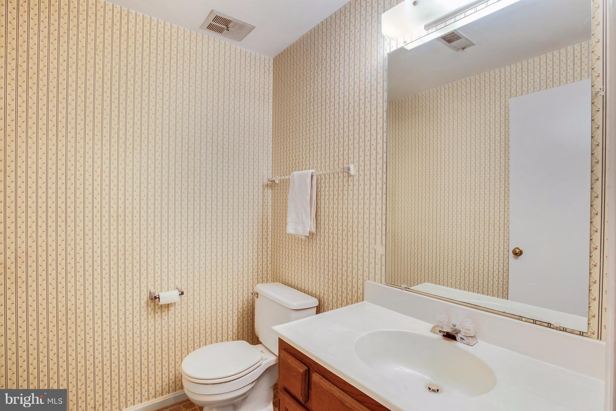 301 Crescendo Way Silver Spring, MD 20901 - Photo 5 of 30 a bathroom with a sink and a toilet