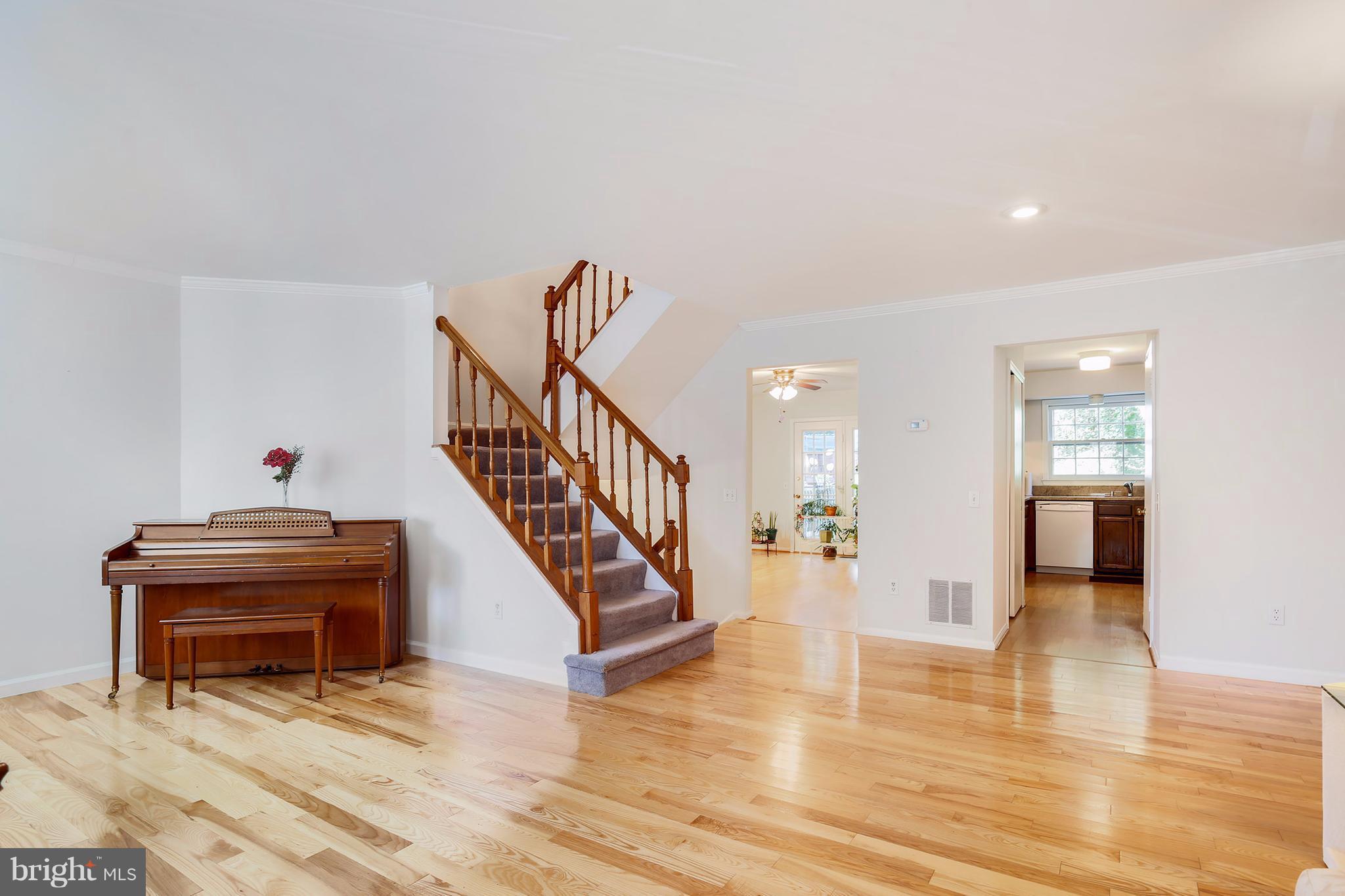 301 Crescendo Way Silver Spring, MD 20901 - Photo 7 of 30 a view of entryway and hall with wooden floor