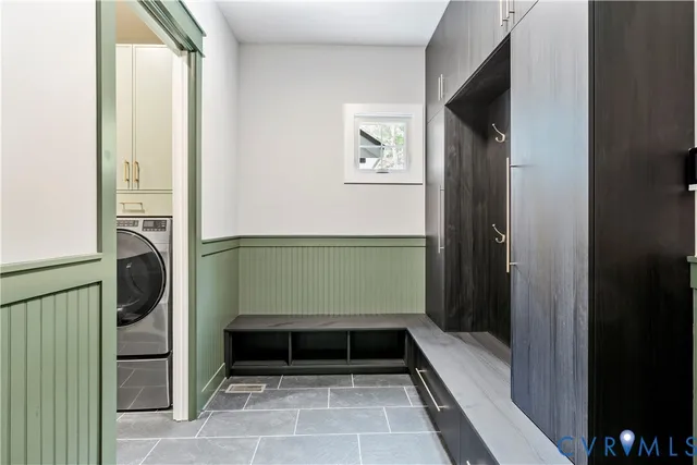 a room with a door open to a mirror