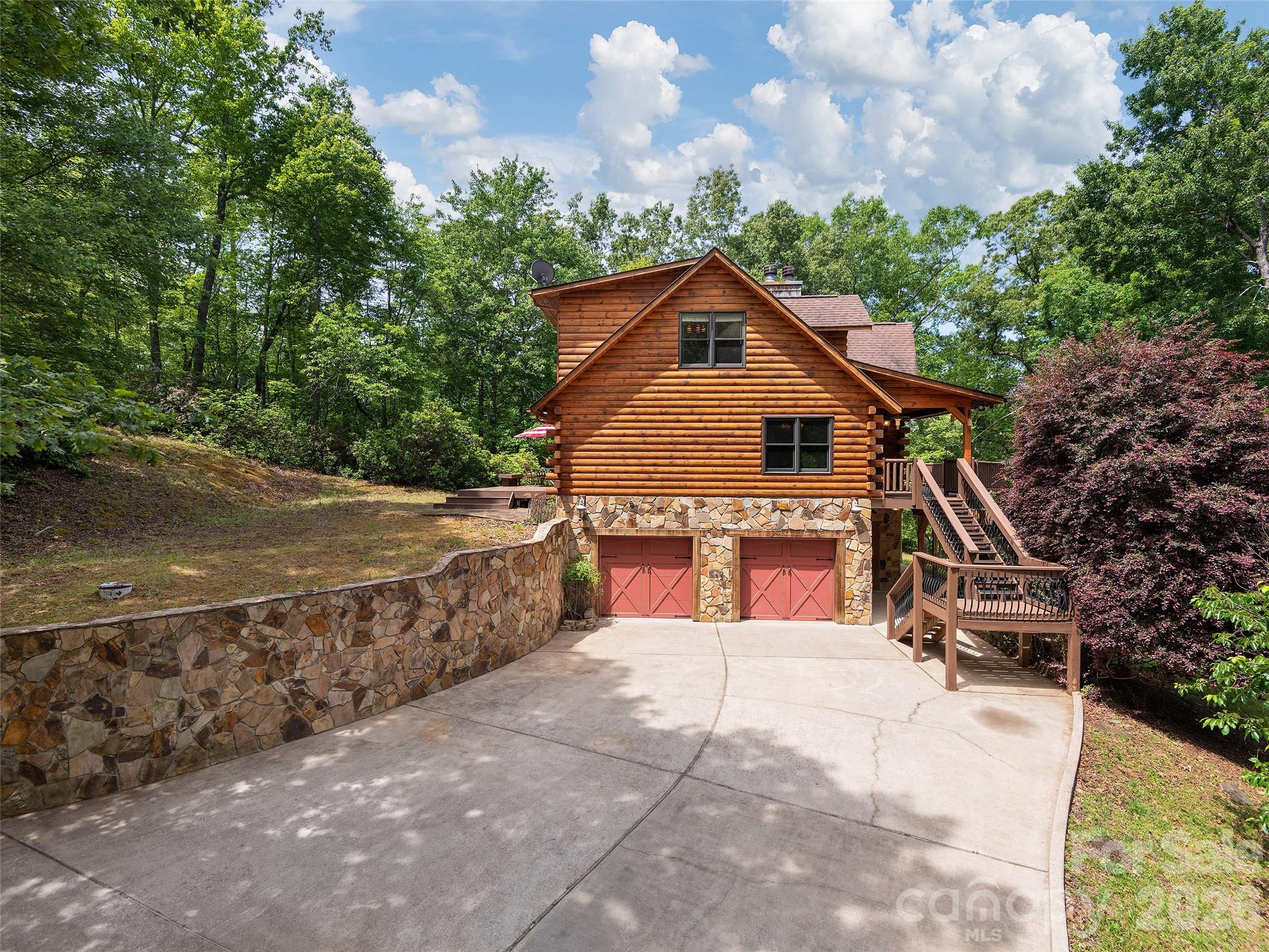413 Green Hills Road Mill Spring, NC 28756 - Photo 3 of 48 a view of a house with a yard