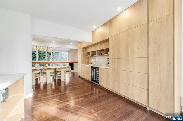 a view of a kitchen with dining table and chairs