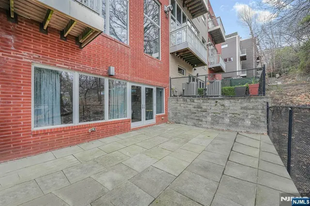a view of a brick building with many windows