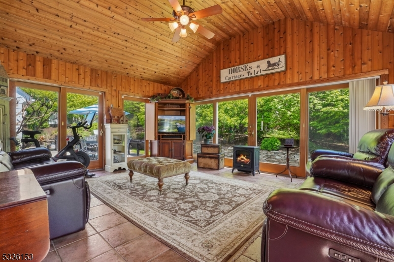 70 Pleasant Run Road Flemington, NJ 08822 - Photo 14 of 50 a view of a living room with furniture and floor to ceiling windows