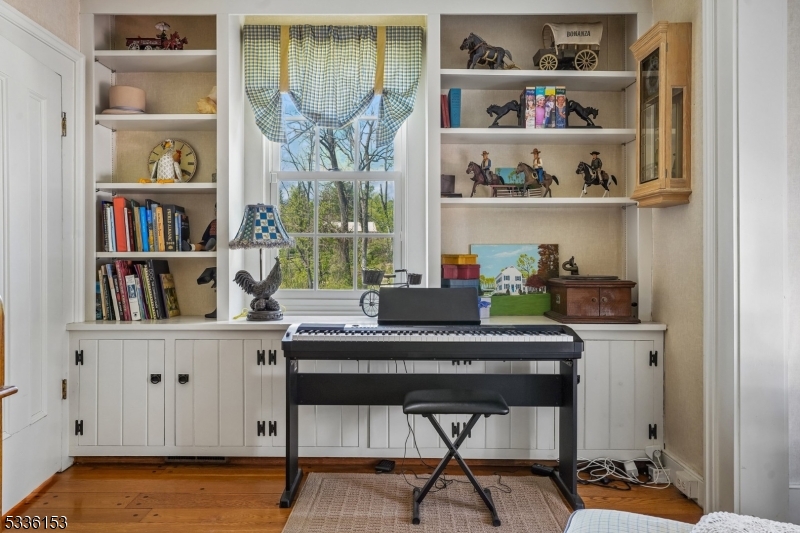 70 Pleasant Run Road Flemington, NJ 08822 - Photo 24 of 50 a room with a table and a book shelf