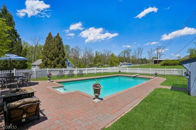 70 Pleasant Run Road Flemington, NJ 08822 - Photo 26 of 50 a view of a swimming pool and lounge chairs in back yard