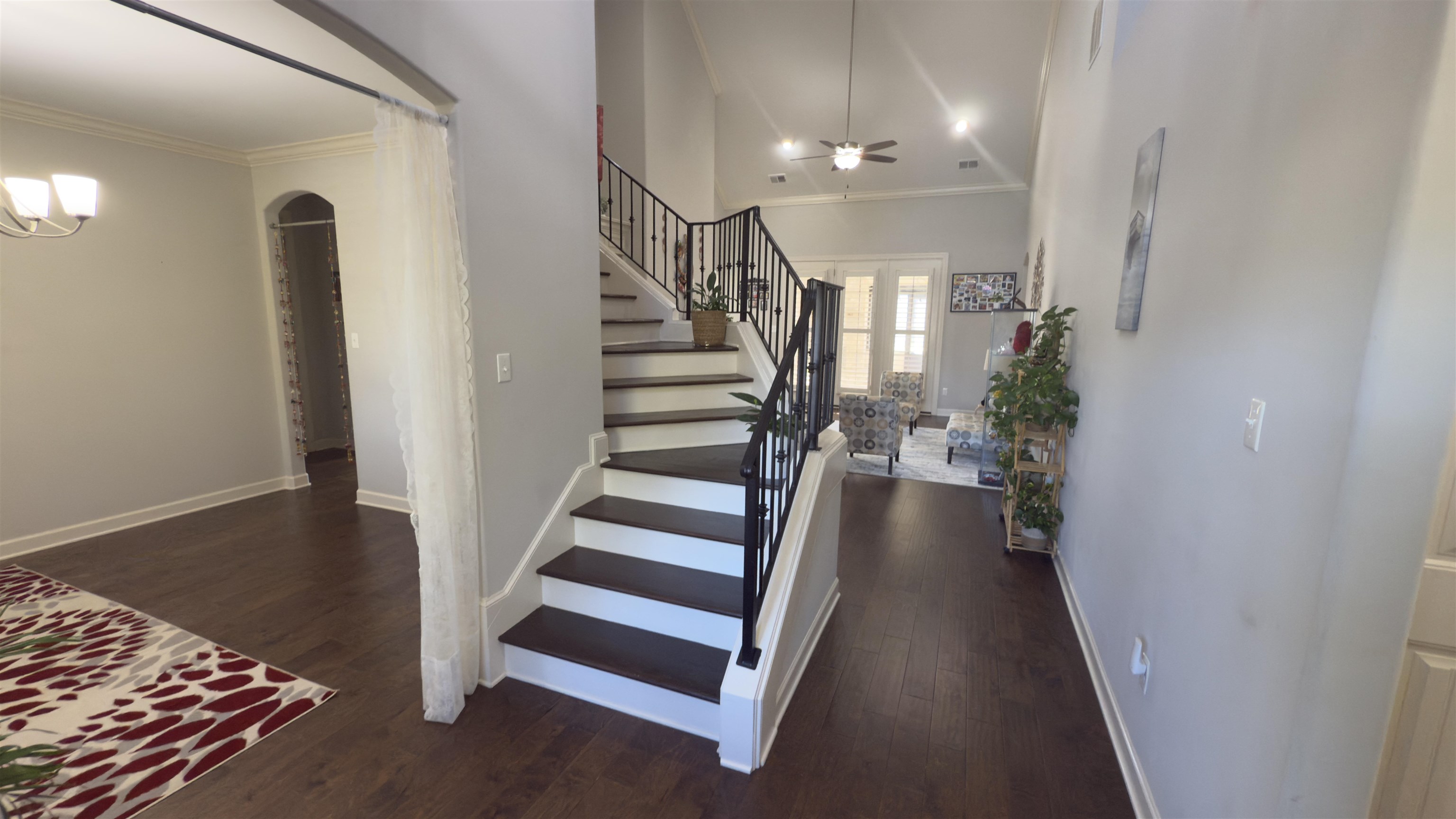 1217 Pilgrim Ridge Road Collierville, TN 38017 - Photo 5 of 33 Stairs with ornamental molding, wood finished floors, arched walkways, and ceiling fan