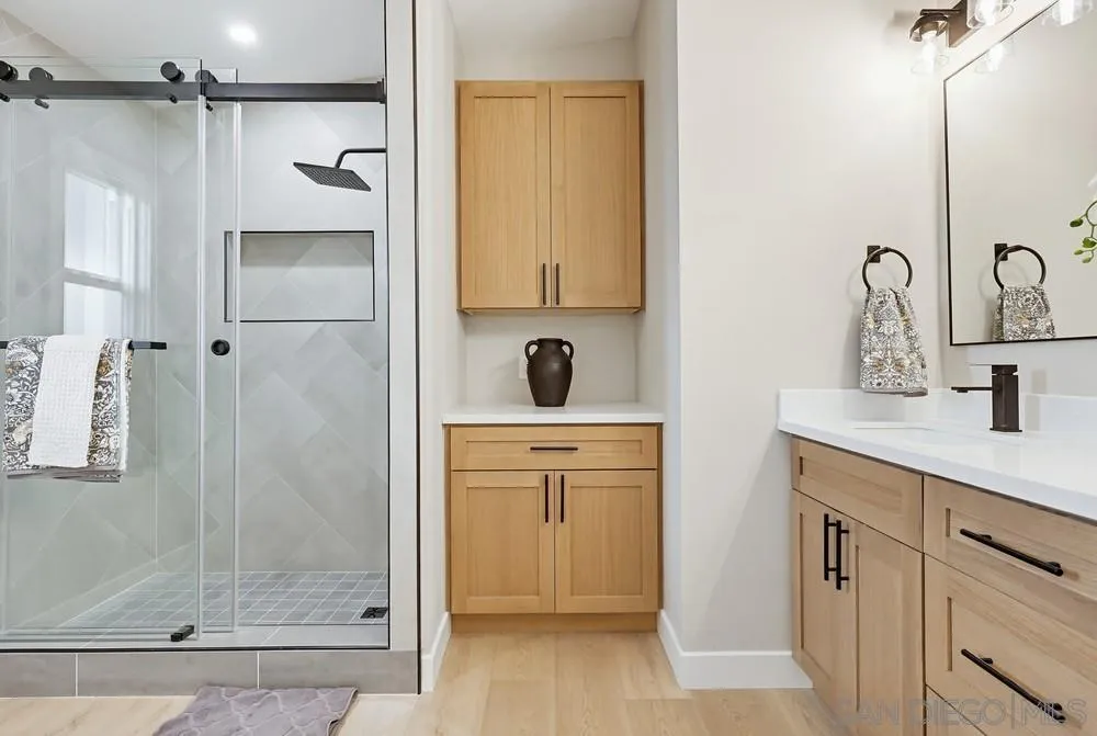 11949 Riverside Drive, Unit 23 Lakeside, CA 92040 - Photo 17 of 27 a bathroom with a shower sink and mirror