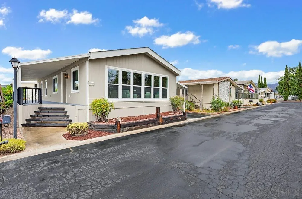 11949 Riverside Drive, Unit 23 Lakeside, CA 92040 - Photo 2 of 27 a view of a house with backyard and sitting area