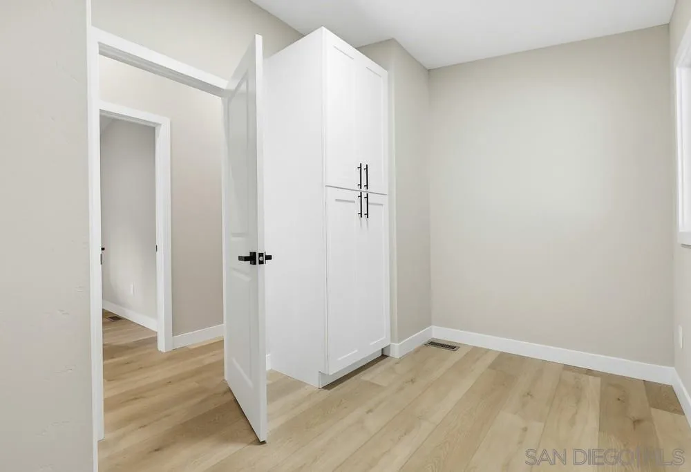 11949 Riverside Drive, Unit 23 Lakeside, CA 92040 - Photo 24 of 27 a view of a livingroom with wooden floor and a hallway