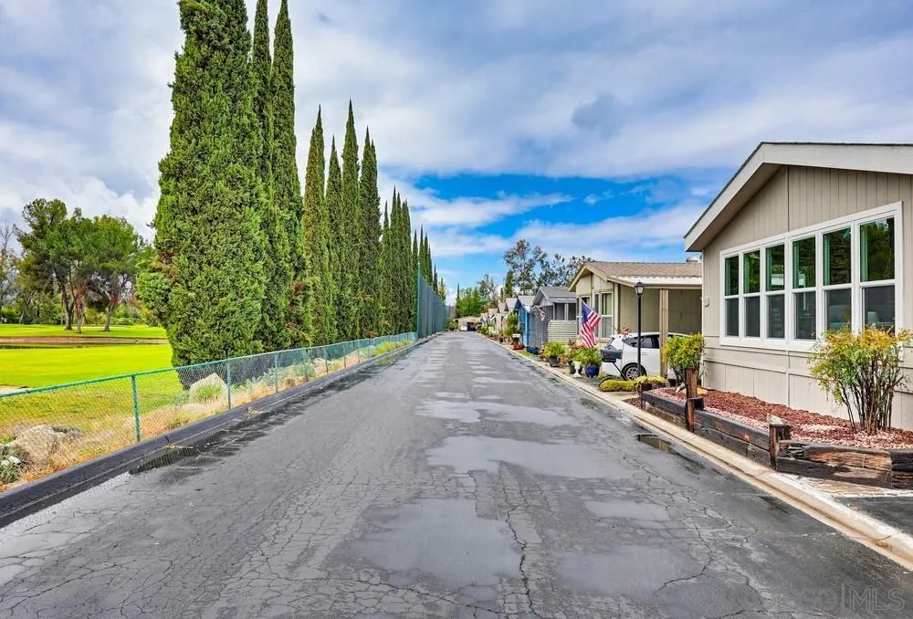 11949 Riverside Drive, Unit 23 Lakeside, CA 92040 - Photo 4 of 27 a view of a house with a yard and potted plants