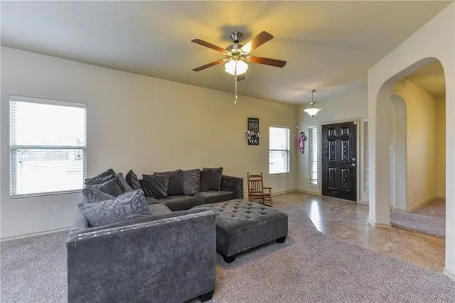 a living room with furniture and window