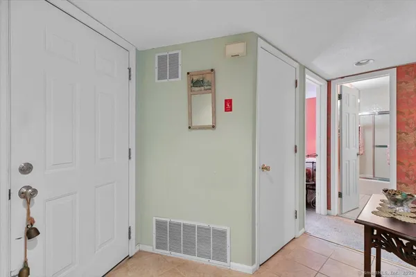 a view of a hallway with seating area
