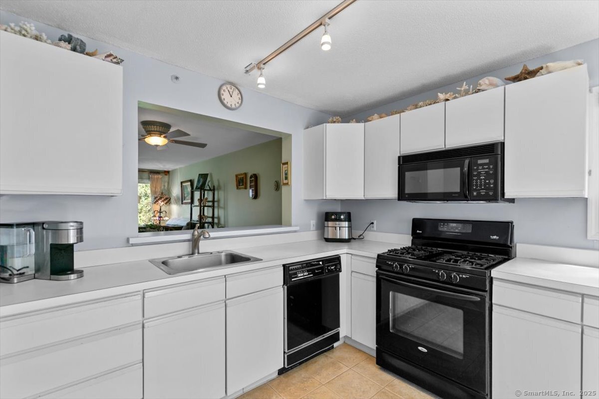 2 Mansfield Grove Road, Unit 262 East Haven, CT 06512 - Photo 13 of 40 Overhead lighting has been added for plenty of light along with the natural light from the 2 updated windows.