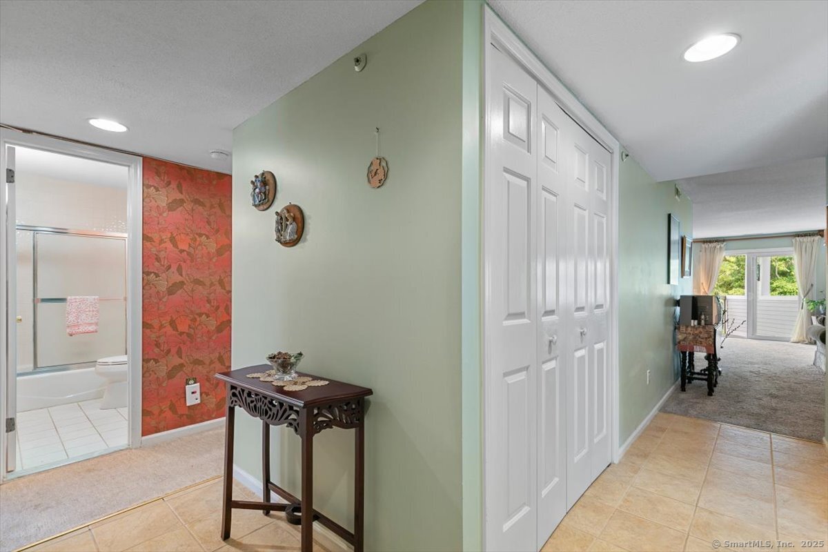 2 Mansfield Grove Road, Unit 262 East Haven, CT 06512 - Photo 13 of 47 The Foyer leads one way to the kitchen and living room and the other way to the beds and baths.