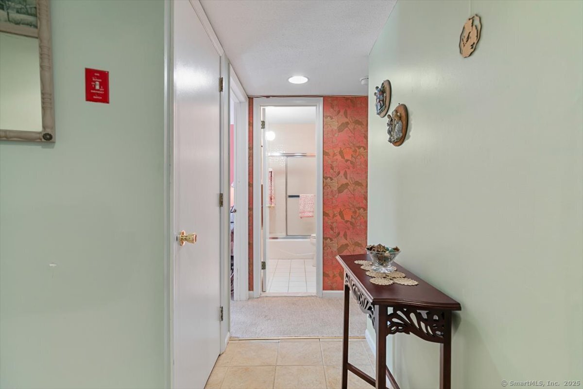 2 Mansfield Grove Road, Unit 262 East Haven, CT 06512 - Photo 14 of 47 You will find a large closet for the washer/dryer and storage in the hallway.