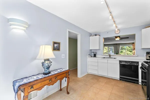 a kitchen with a sink stove and microwave