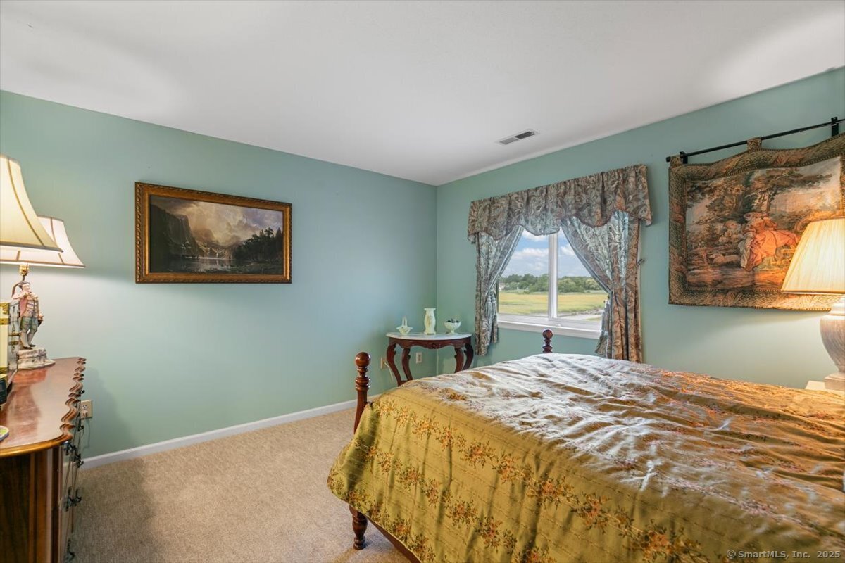 2 Mansfield Grove Road, Unit 262 East Haven, CT 06512 - Photo 25 of 47 The primary bedroom has a large updated closet with California Closet inserts.