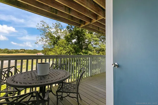 a view of a backyard with hardwood area
