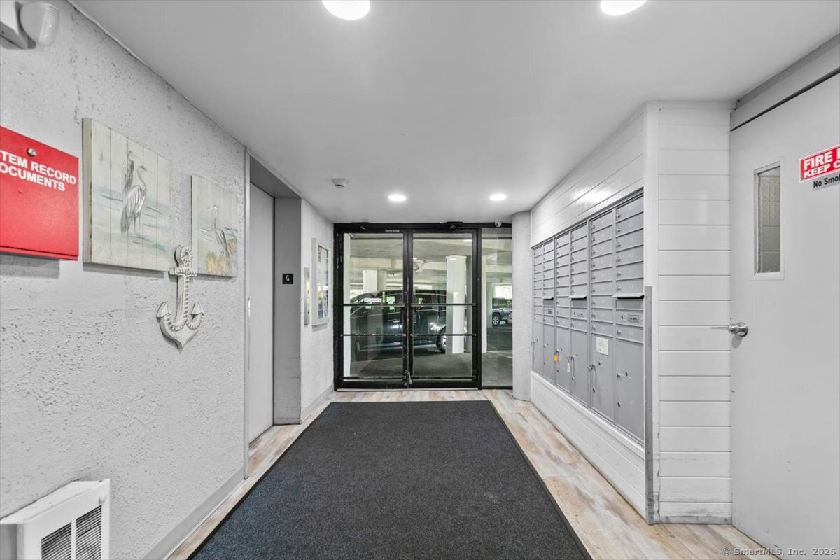 2 Mansfield Grove Road, Unit 262 East Haven, CT 06512 - Photo 32 of 47 The mail room is located at the garage level and allows for large packages along with private mail boxes.
