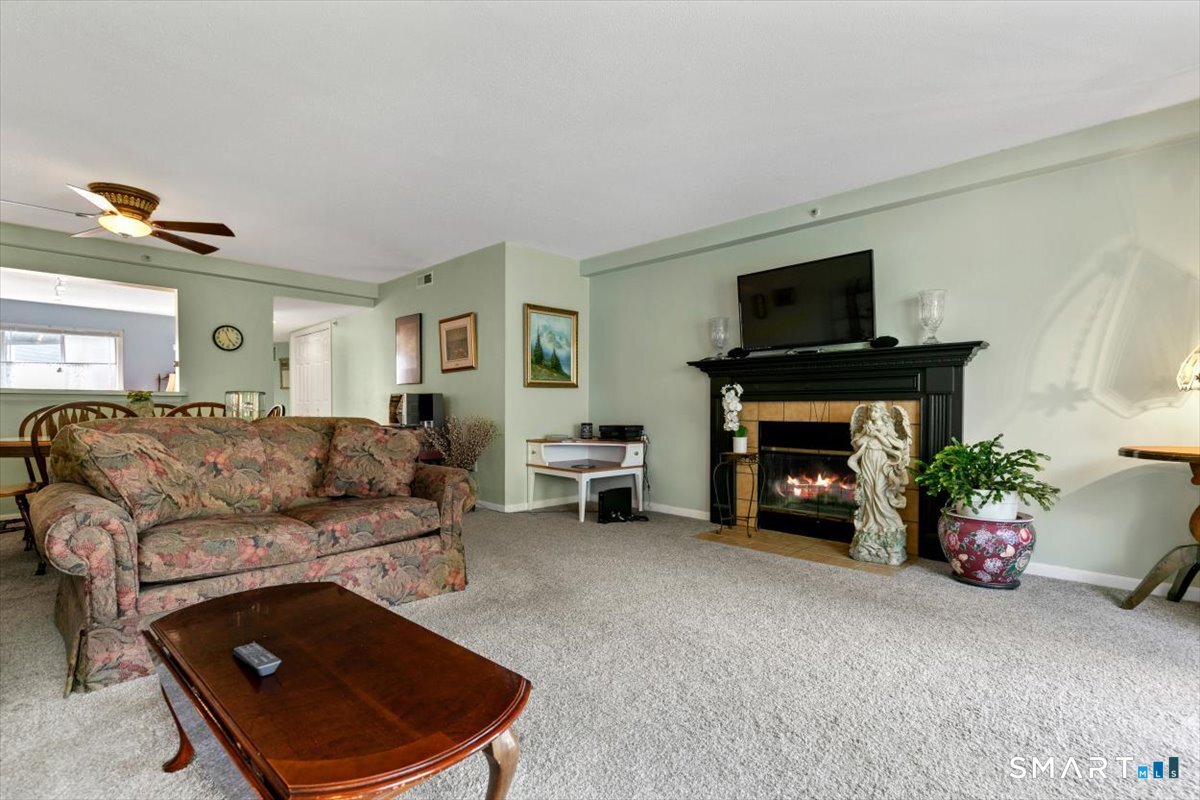 2 Mansfield Grove Road, Unit 262 East Haven, CT 06512 - Photo 6 of 40 The dinning area off the kitchen flows directly into the living room and out onto the balcony.
