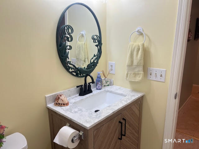 2 Mansfield Grove Road, Unit 262 East Haven, CT 06512 - Photo 9 of 40 The hall bath has been updated with new vanity, mirror and fresh paint.