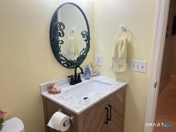 a bathroom with a sink and a mirror