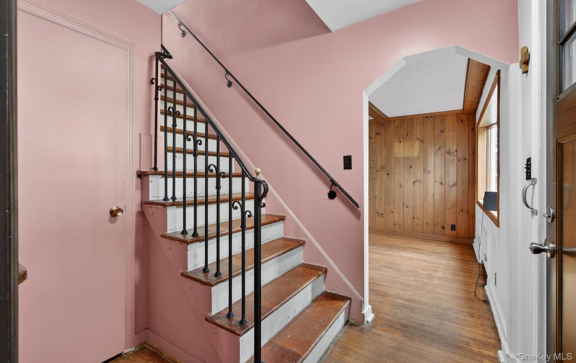 24 Purdue Road Glen Cove, NY 11542 - Photo 22 of 41 a view of staircase with wooden floor and white walls