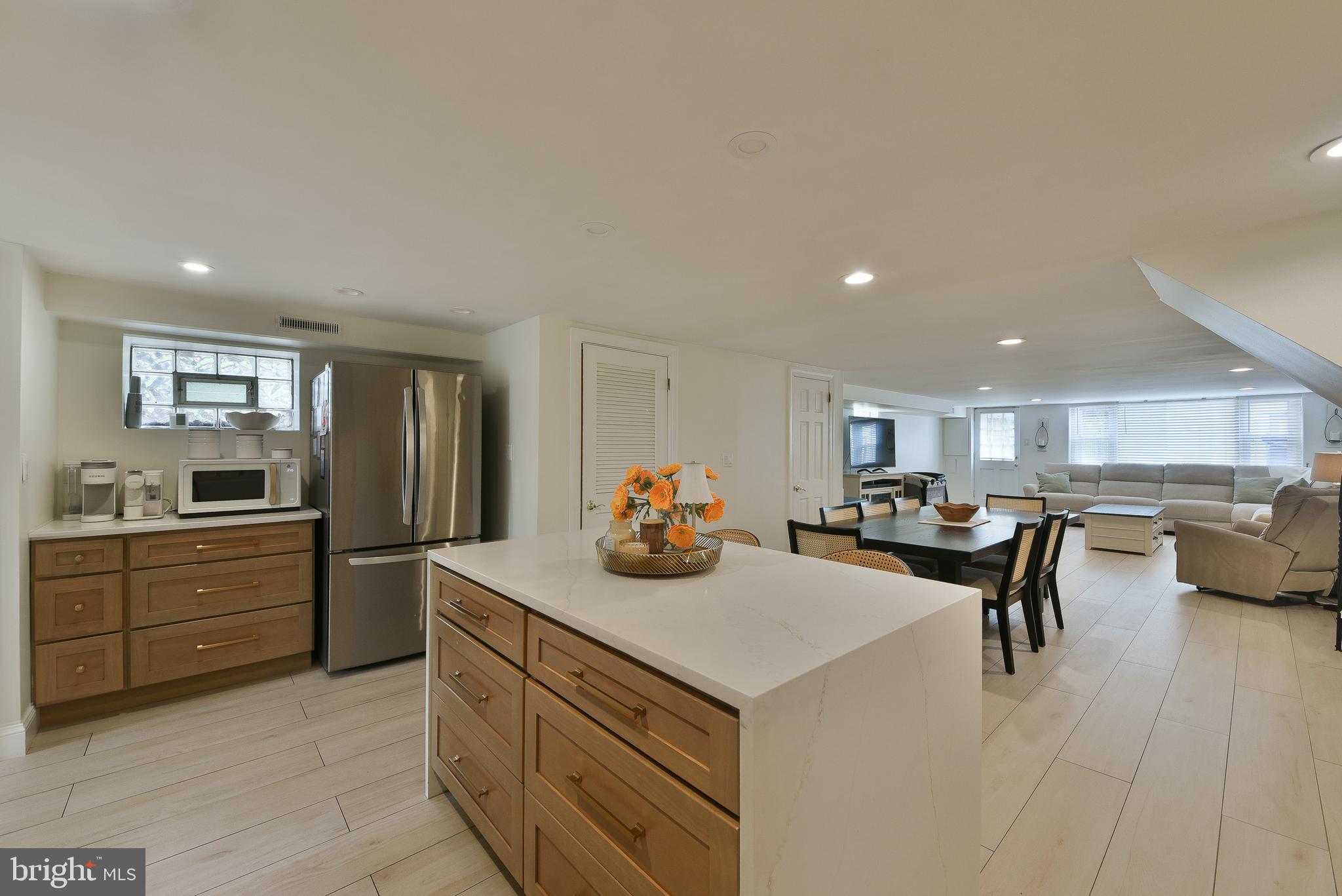 3137 Draper Street Philadelphia, PA 19136 - Photo 10 of 39 a kitchen with refrigerator and chairs