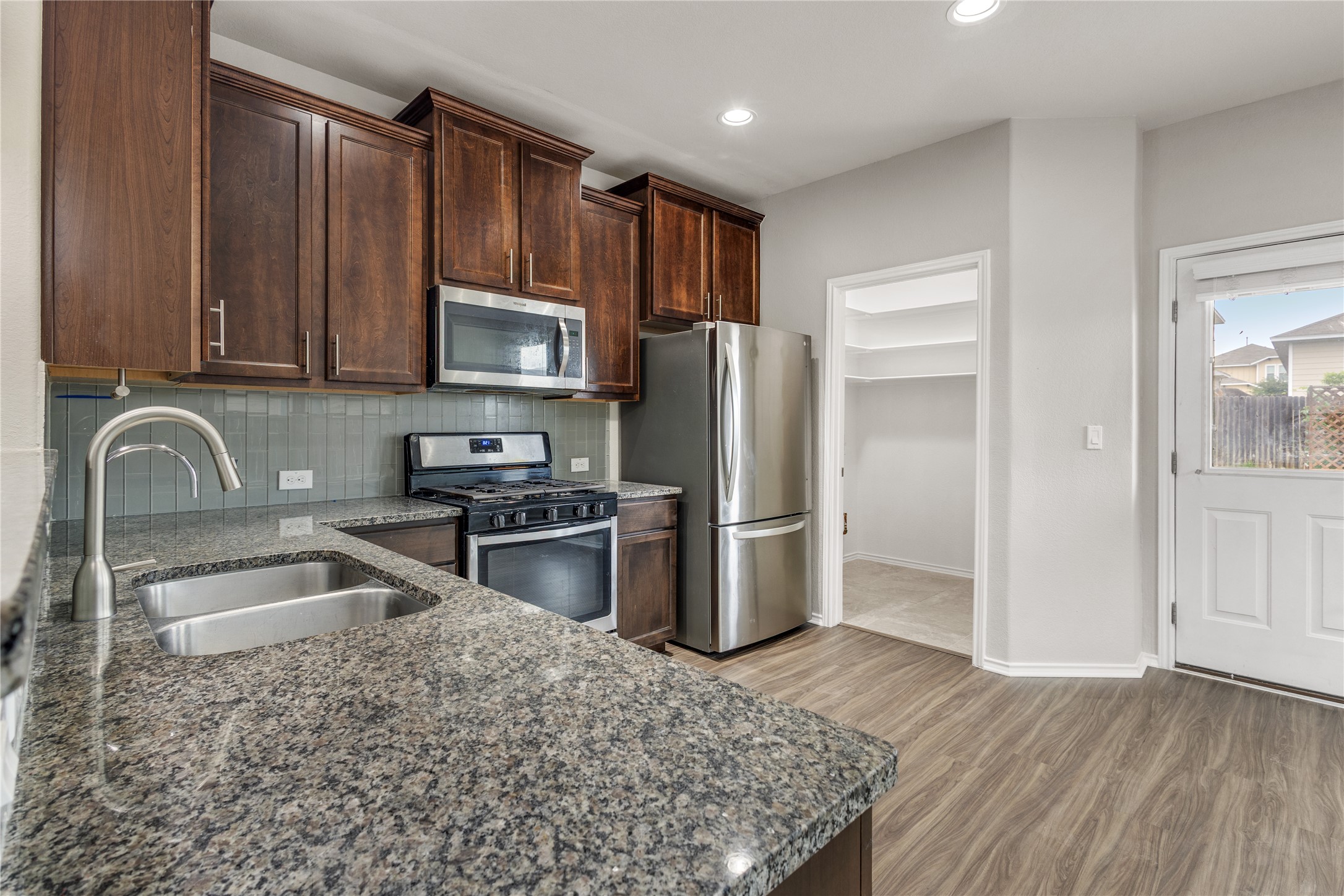 397 Limerick Road Buda, TX 78610 - Photo 8 of 33 The granite countertops offer plenty of room for meal prep and the breakfast bar is perfectly positioned for casual morning coffee or keeping the cook company.