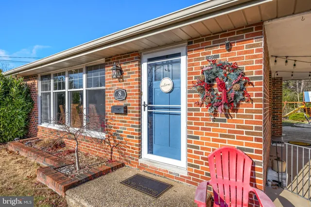 a front view of a house with a porch
