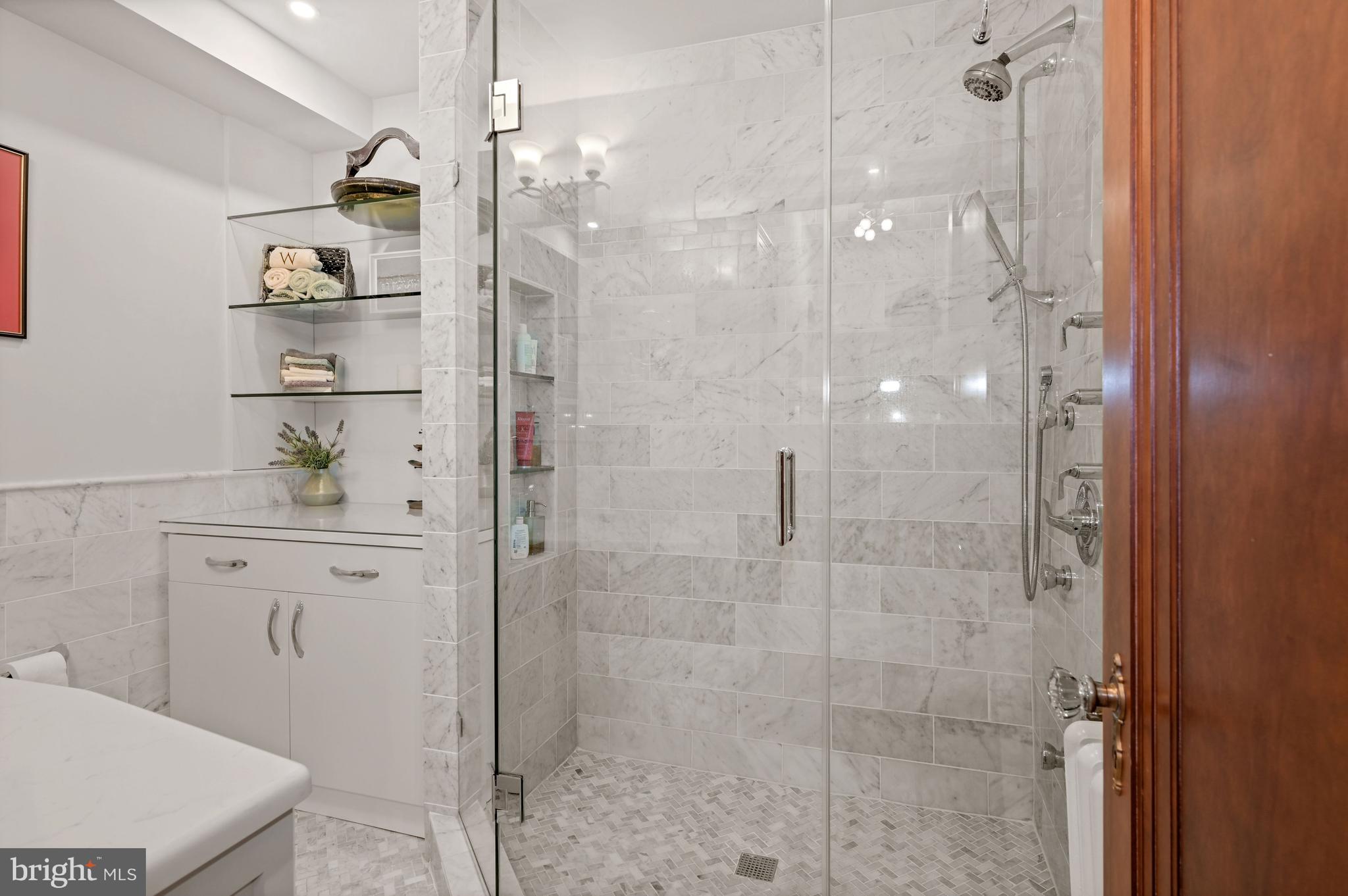 2737 Devonshire Place Northwest, Unit 123 Washington, DC 20008 - Photo 21 of 46 Custom glass shower w/ 5 faucets