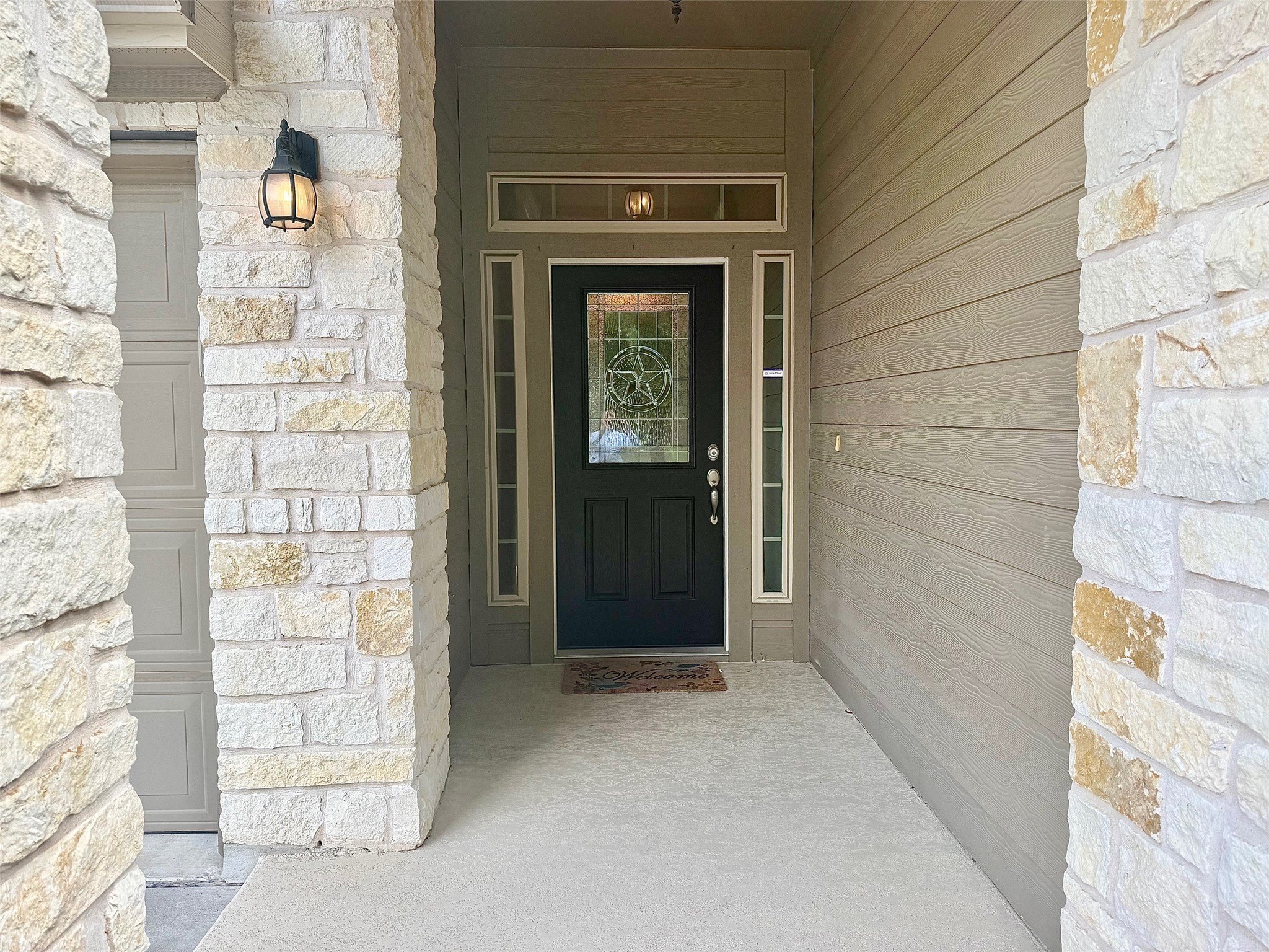 513 Longhorn Cavern Road Leander, TX 78641 - Photo 2 of 24 View of exterior entry featuring stone siding and a porch