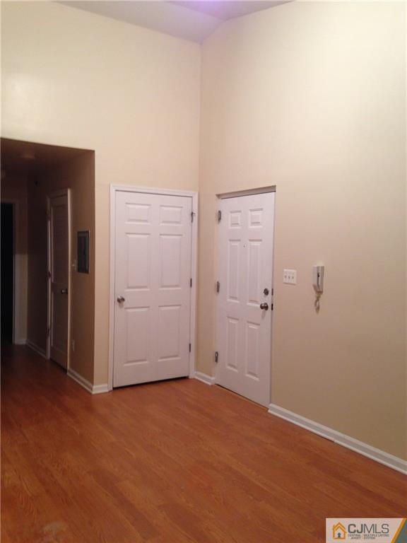 1130 Edpas Road, Unit 1130 New Brunswick, NJ 08901 - Photo 2 of 12 an empty room with closet area