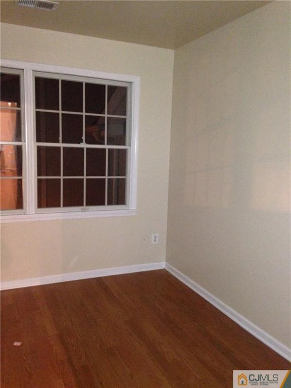 1130 Edpas Road, Unit 1130 New Brunswick, NJ 08901 - Photo 9 of 12 a view of empty room with windows