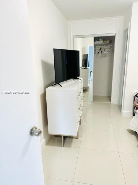 1030 Northeast 80th Street, Unit 4 Miami, FL 33138 - Photo 14 of 28 a living room with a couch and a table
