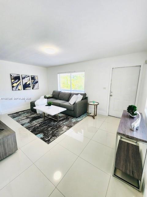 1030 Northeast 80th Street, Unit 4 Miami, FL 33138 - Photo 2 of 28 a living room with furniture and a window