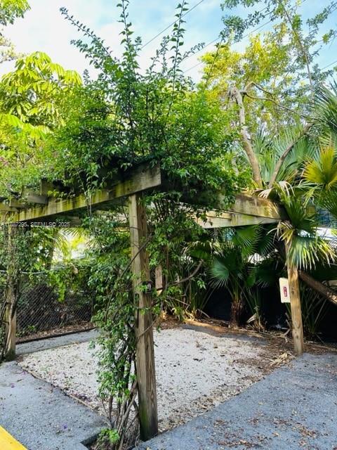 1030 Northeast 80th Street, Unit 4 Miami, FL 33138 - Photo 25 of 28 a backyard of a house with lots of green space