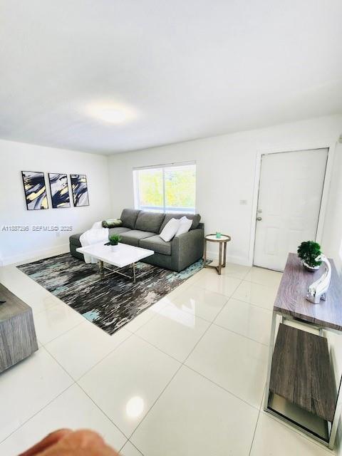 1030 Northeast 80th Street, Unit 4 Miami, FL 33138 - Photo 4 of 28 a living room with furniture and a rug