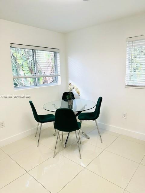 1030 Northeast 80th Street, Unit 4 Miami, FL 33138 - Photo 5 of 28 a dining room with furniture and window